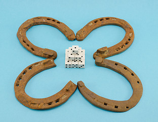 Image showing clover retro horse shoes gamble dice on blue 