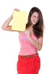 Image showing Girl with a blank sheet of paper winks