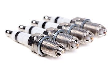 Image showing Four new spark plugs