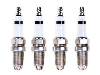 Image showing Four spark plugs. Isolated on white.