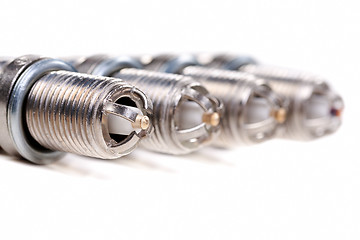 Image showing Four automobile spark plugs closeup