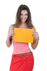 Image showing Beautiful woman holding empty orange board