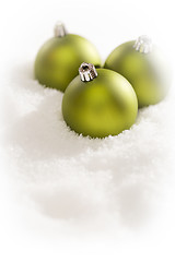 Image showing Green Christmas Ornaments on Snow Flakes with Text Room