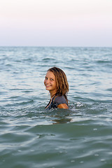Image showing smiling teen girl in the sea
