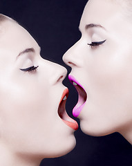 Image showing two beautiful faces with open mouth and lipstick
