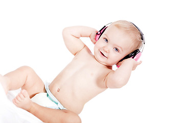 Image showing cute little baby with protection earphones 