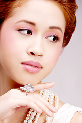 Image showing pretty asian girl with luxury jewelery and soft makeup