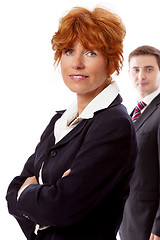 Image showing red head woman in business outfit  front man  background