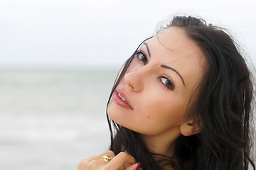 Image showing cute young woman on the beach