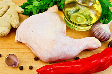 Image showing Chicken leg with vegetables and oil