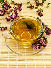 Image showing Herbal tea with oregano on bamboo