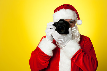 Image showing Say cheese! Santa capturing a perfect moment