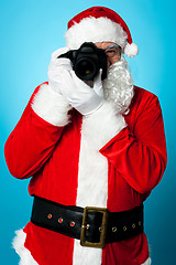 Image showing Santa Claus turns into a pro photographer