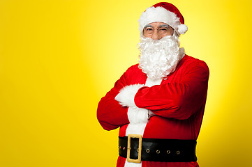 Image showing Saint Nick posing confidently against yellow background