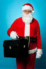 Image showing Santa is all set to visit his new office, holding briefcase