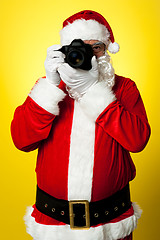 Image showing Smile please! Santa capturing a perfect frame