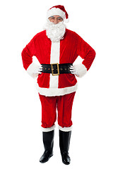 Image showing Cheerful Santa Claus posing with hands on waist