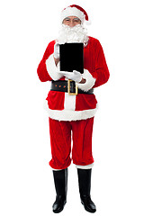 Image showing Santa showing newly launched tablet pc