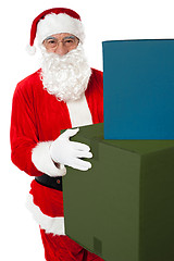 Image showing Photo of kind Santa Claus giving xmas presents