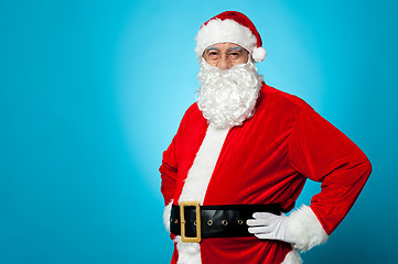 Image showing Aged Santa posing with hands on his waist