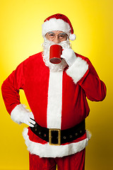 Image showing Portrait of a aged Santa sipping coffee