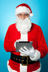 Image showing Modern Santa using digital touch screen device