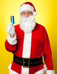 Image showing Male in Santa costume posing with his cash card