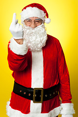 Image showing Angry Santa showing middle finger