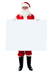 Image showing Saint Nicholas standing behind blank whiteboard