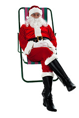 Image showing Isolated aged Santa relaxing. Vacation time