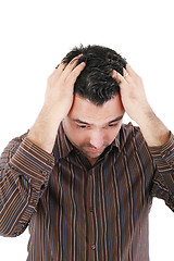 Image showing a worried man looking down thinking 