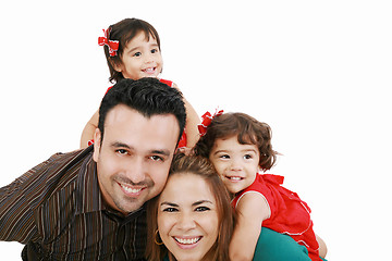 Image showing Beautiful family enjoying, mom and dad playing with their daught