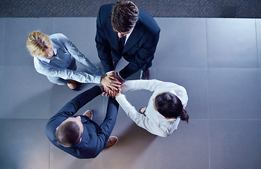 Image showing business people group joining hands