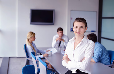 Image showing business woman with her staff in background at office