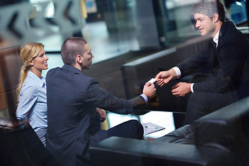 Image showing business people making deal