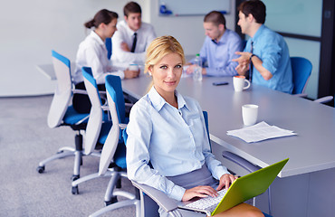 Image showing business woman with her staff in background at office