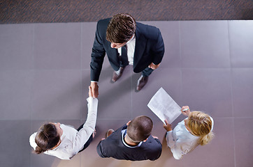 Image showing business people making deal