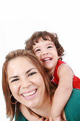 Image showing Portrait of happy daughter enjoying a piggyback ride on mothers 