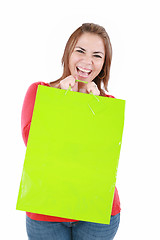 Image showing lovely woman happy with shopping bag over white