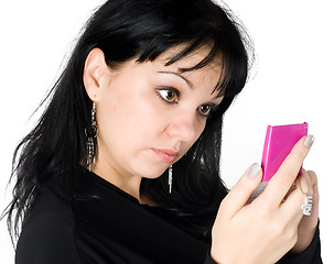 Image showing young woman looking in mirror