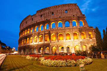 Image showing Beautiful view of Colosseum at sunset with flowerbed in foregrou