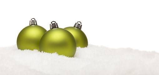 Image showing Green Christmas Ornaments on Snow Flakes Isolated on White