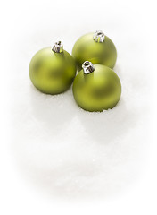 Image showing Green Christmas Ornaments on Snow Flakes Isolated on White