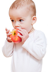 Image showing Baby girl eating healthy food isolated