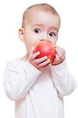 Image showing Baby girl eating healthy food isolated