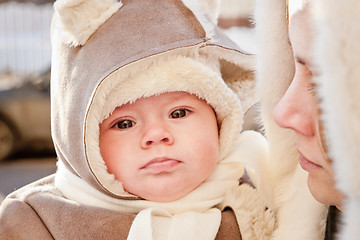 Image showing Mother with baby in winter