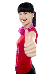 Image showing Carefree teenager flashing thumbs up sign