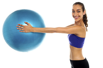 Image showing Fitness enthusiast holding a swiss ball