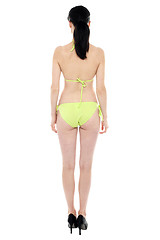 Image showing Bright picture of beautiful woman in bikini. Back pose