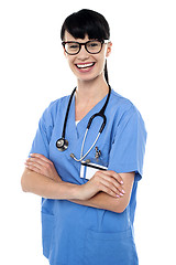 Image showing Cheerful doctor with stethoscope around her neck